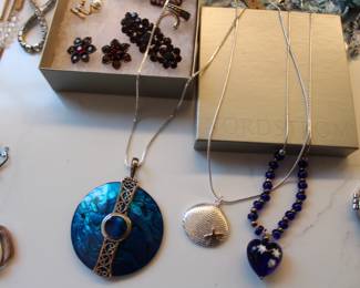 large collection of costume jewelry along with various sterling silver pieces.
