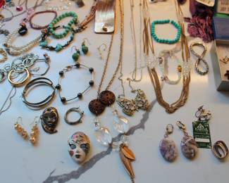 large collection of costume jewelry along with various sterling silver pieces.