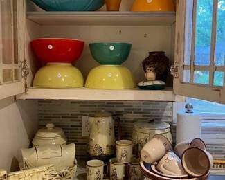 Pyrex vintage bowls, McCoy Western cookie jars, coffee pot and mugs.