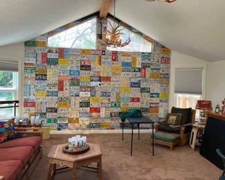 Wall of license plates, Brandt Ranch Oak furniture, sofa, coffee table, chair, ottoman and buffet.