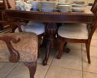 ornate dining table and six chairs