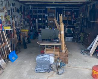 GARAGE FULL OF TOOLS AND OTHER ITEMS FOR CONSTRUCTION PURPOSES.