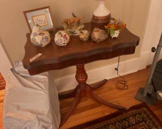 Vintage game table with quail figurines