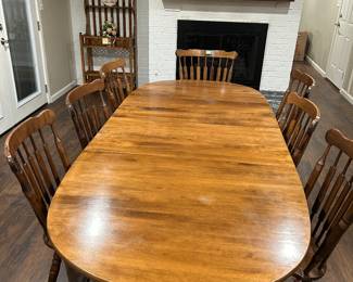 Table has 3 leaves 6 side chairs and 2 arm chairs