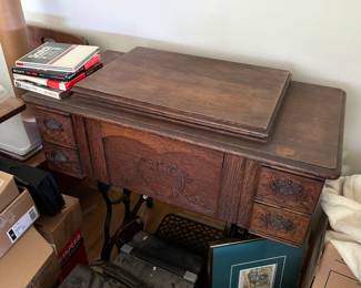 Old sewing machine in cabinet