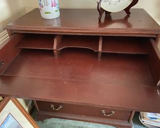 Dresser with top drawer that folds to a desk