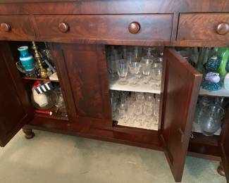 Interior of antique sideboard, there are three keys, one for each locking cabinet