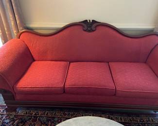 Victorian sofa with red jacquard pattern fabric and carved Eagle detail