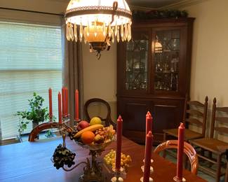 Lovely formal dining room with pewter candleabras and vintage lamp with crystals