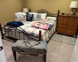 King size metal and wood bed, upholstered bench, chest, lamps, linens, quilts