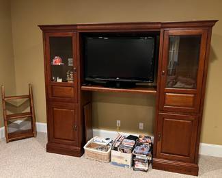Entertainment center, tv, Wii console and accessories, movies, blanket ladder