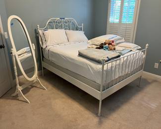 Full size white painted iron bed, dressing mirror, linens