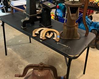 Iron school bell, cast iron farm pump, andirons