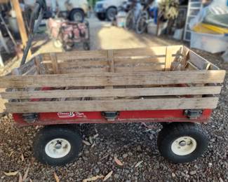 Classic Flyer has all 4 wood sides the bottom is wood and has been well used, tires are pretty new, the rest is all original :)