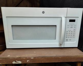 GE microwave NEW It was installed and never used the new owner wanted stainless steel. So it was pulled out and brought back to sell see next pic ...really never used