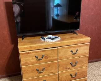 small chest used as a TV stand