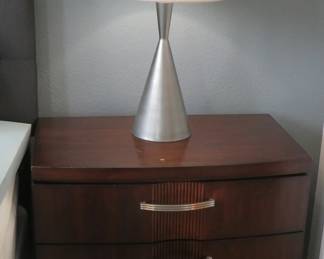 One of two nightstands and lamps