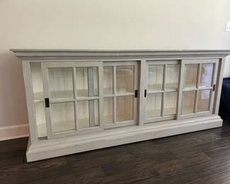 tv center with glass sliding doors