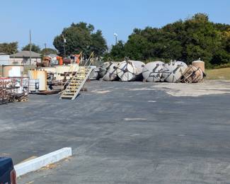 Outside view of removed tanks and equipment. Will need to provide trailers and equipment to pick up these items.