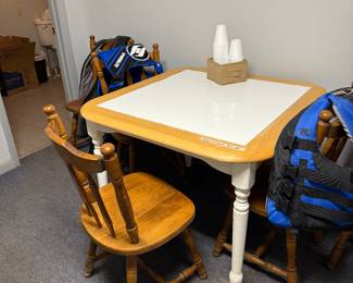Table and 5 chairs and 4 life jackets