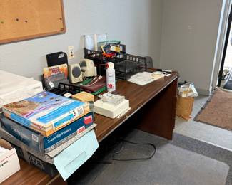 Many office supplies and solid wood desk