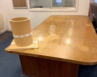 Top of solid wood desk and cork board