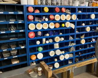Metal bins with many kinds of screws, bolts and nuts