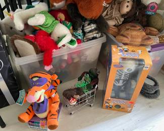 Bins stuffed with new & dusty stuffed animals