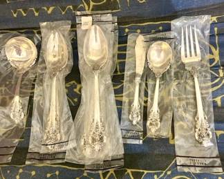 112-Piece Wallace Grand Baroque Sterling Silver - 12 Place Setting with Serving Pieces and wooden Pacific Silvercloth storage chest. MOST PIECES STILL IN ORIGINAL WALLACE PLASTIC PACKS -NEVER OPENED OR USED.