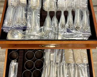 112-Piece Wallace Grand Baroque Sterling Silver - 12 Place Setting with Serving Pieces and wooden Pacific Silvercloth storage chest. MOST PIECES STILL IN ORIGINAL WALLACE PLASTIC PACKS -NEVER OPENED OR USED.