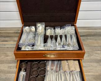 112-Piece Wallace Grand Baroque Sterling Silver - 12 Place Setting with Serving Pieces and wooden Pacific Silvercloth storage chest. MOST PIECES STILL IN ORIGINAL WALLACE PLASTIC PACKS -NEVER OPENED OR USED.