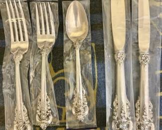 112-Piece Wallace Grand Baroque Sterling Silver - 12 Place Setting with Serving Pieces and wooden Pacific Silvercloth storage chest. MOST PIECES STILL IN ORIGINAL WALLACE PLASTIC PACKS -NEVER OPENED OR USED.