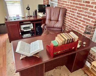 Office has a very nice executive desk, chair and credenza.