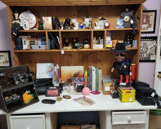Solid wood 2 piece desk. Mantle clock, dancing & singing Hank Williams Jr., CD box sets, Betty Boop clock, and more