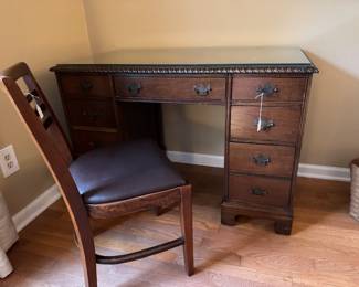 Two pillar desk with carved braided rope trim and glass top
