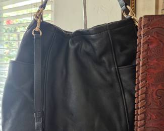 Very nice black leather Coach tote bag with dust cover