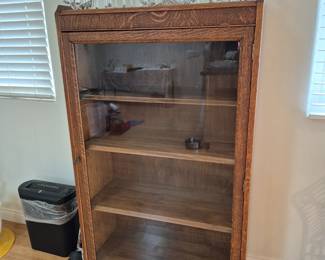 Antique oak display/bookcase. Very nice crystal Glassware on top.