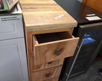 #174 Wood chest of 4 drawers w/laminate top - 13x26x36 on wheels $25.00