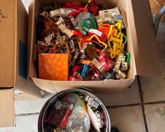there are 3 almost full very large boxes of cookie cutters!