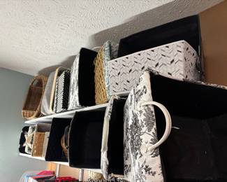 Tons of nice storage bins cloth wicker and Rubbermaid types probably at least 50 and up to 100 