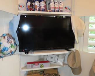 Small TV, shelves of vitamins and Ensure, vacuum sealed food bags and sealer. Boxes of bio degradable bags.