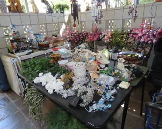 tables of battery operated lights, vases, silk flowers, Halloween decor.