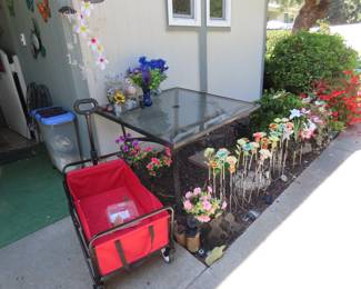 Folding wagon, Solar light flowers, patio table and wind chimes.