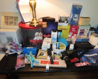 Brand new items, phone cases, passport holders, travel fans, boxed games. Sewing drawers, photo frames, bluetooth earphones, . Lots of new items.