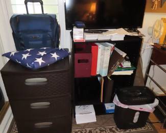 Plastic drawers, luggage, TV, bookcase, shredder, binders and office supplies.