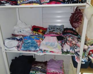 Shelves of tee shirts and sweat shirts.