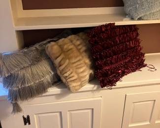 an assortment of decorative pillows