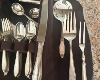 #99 - $120 - Silver flatware in case