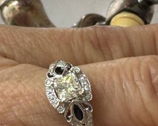 #175 - $800 - 18kt white gold ring with 1/2 ct princess center stone, sapphires on sides, size 6.5