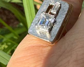 $3,250 - One 14kt yellow gold ladies diamond ring that contains one (1) emerald cut diamond that measures approx. 1.34 carats. Also one baguette cut diamond 0.16ct. The Diamonds are "G-H" in color and "VS2" in clarity. The ring weights 7.60 grams including the stones. combined weight of both stones 1.50 carats.
